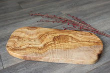Wooden cutting board , olive wood , rustic